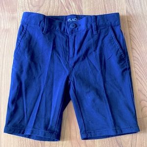 Navy blue girl size 5 uniform shorts. Adjustable elastic button waste.